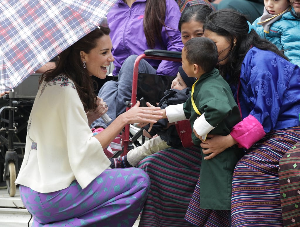 Kate met a young child during an archery demonstration on the couple's trip to Bhutan in April 2016.