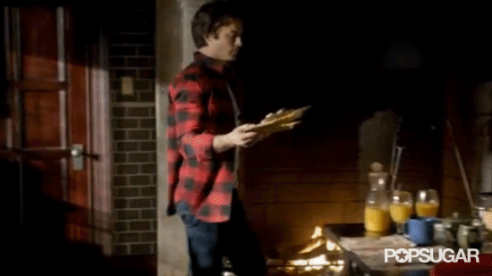 While we don't really think this is heaven, it's got to be somewhere Damon is very happy, because he's rocking bright red flannel and making adorable pancakes.