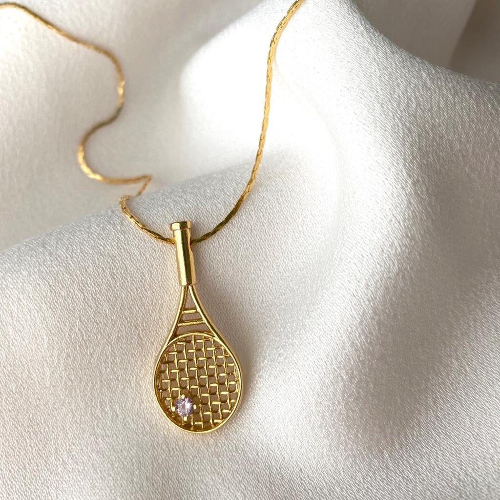 A Luxurious Accessory: Gold Tennis Racket Pendant