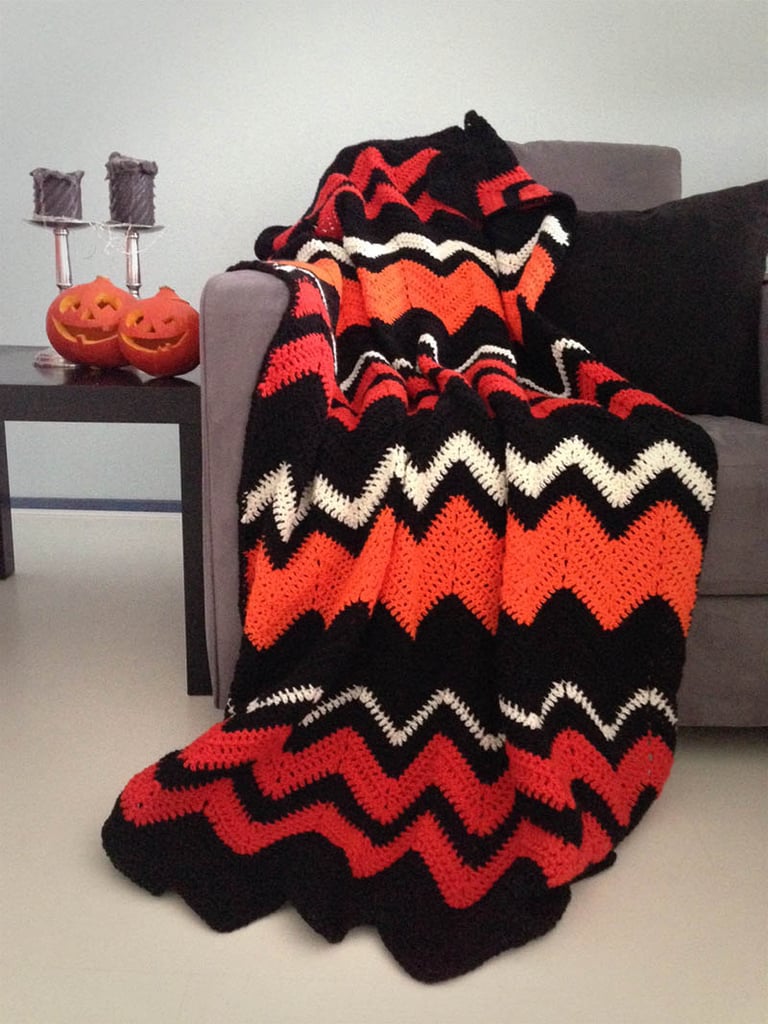 Stay cozy in true Halloween form with this orange and black handmade chevron knit blanket ($124)