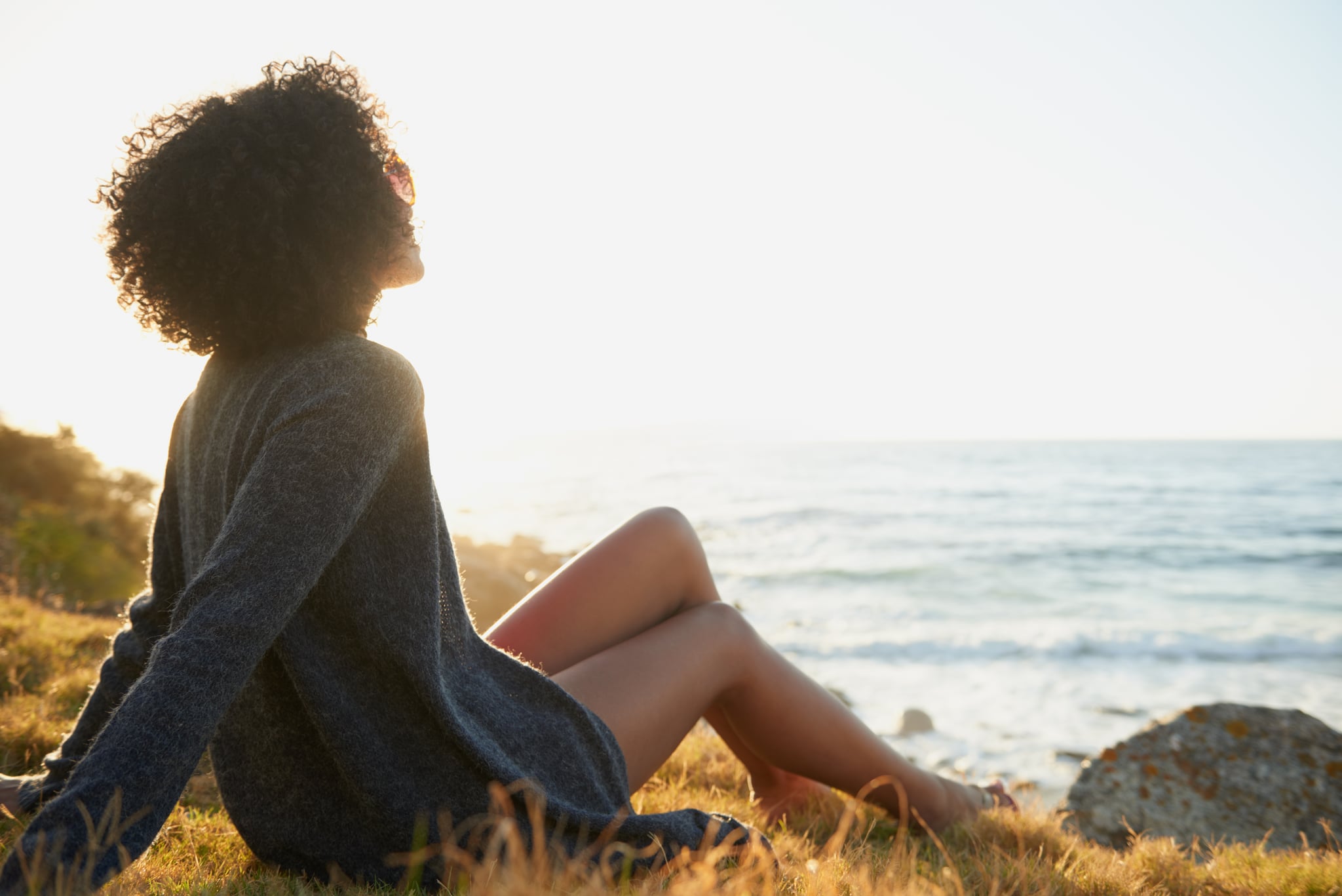 Shot of an attractive young woman relaxing outdoors with a view of the oceanhttps://195.154.178.81/DATA/istock_collage/a5/shoots/785271.jpg