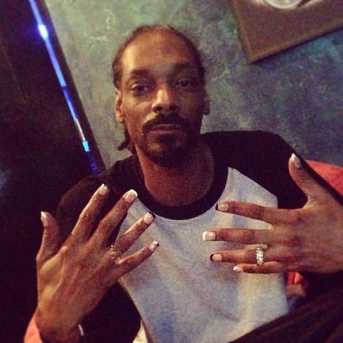 Who knew that Snoop Lion was such a nail art fan? The rapper recently got his nails done by Hey Nice Nails, a manicurist duo based out of Long Beach, CA. The nail artists posted snaps of Snoop's mani on Instagram, saying they paid him a house call for the special black-and-white french-tip job. In addition to the elegant tips, Snoop still had to Snoop-ify his manicure with gold dollar sign and marijuana leaf accents. To top it all off, he wore a marijuana ring on his right hand. Snoop has yet to publicly comment on his pampering session, but we're sure this is a manicure that Snoop's pal, Miley Cyrus, would approve of.
Source: Instagram user heynicenails