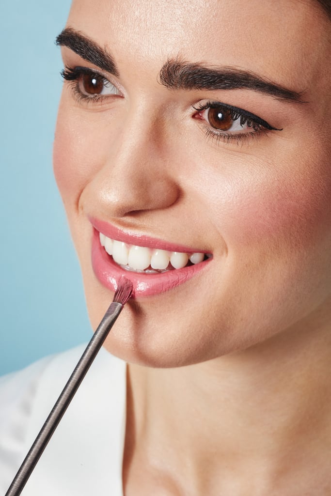 You can see how the highlighter not only adds to the sultry balminess of the lip's texture, but makes her teeth look seriously bright.