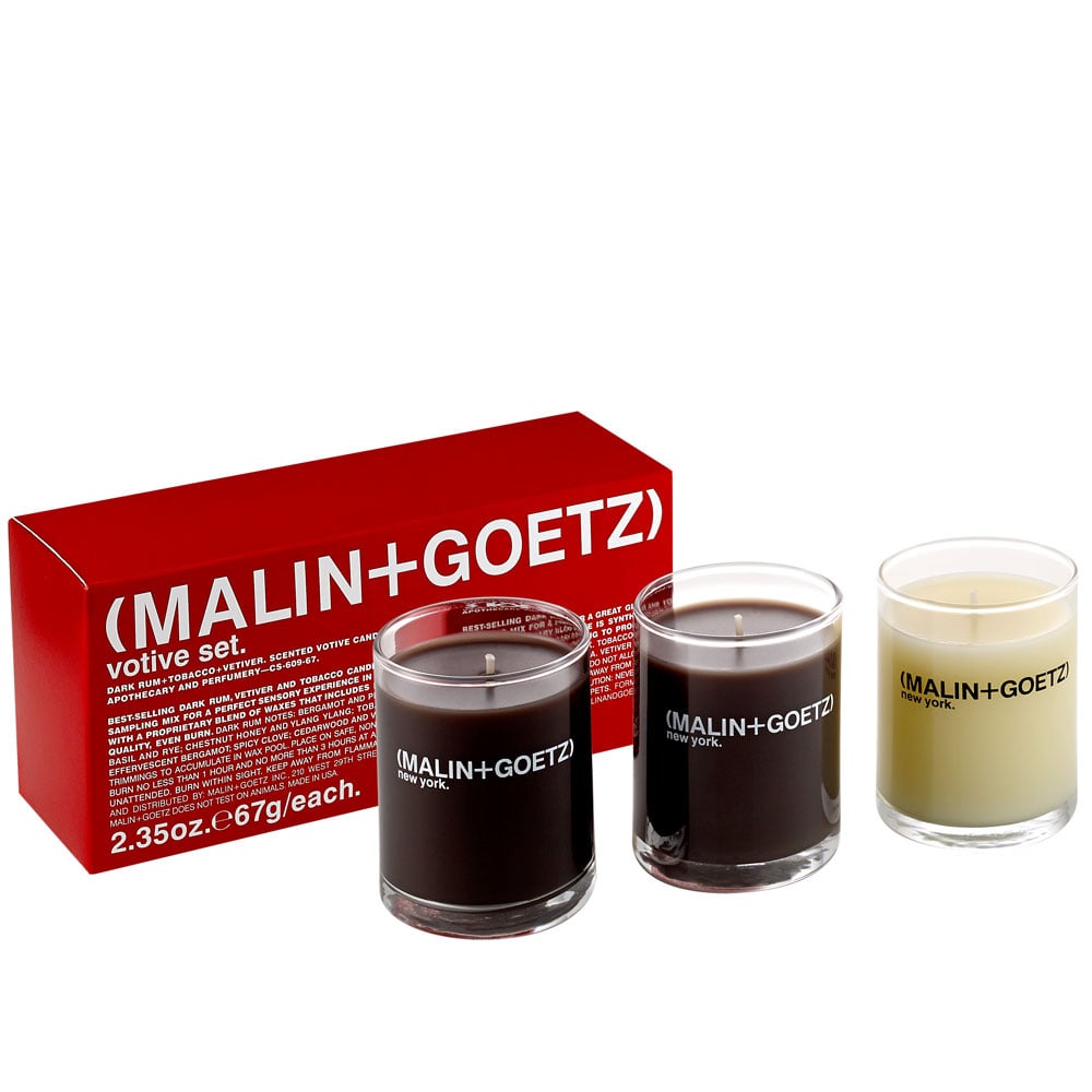 What these petite votives lack in size, they more than make up for with their mighty scents. The trio includes the brand's bestselling Dark Rum, Vetiver, and Tobacco candles that are all richly fragranced but distinctly different from one another. Dark Rum has a warm sweetness that is balanced by notes of patchouli and milk. The Tobacco scent is smokier (surprise!), but bourbon and vanilla keep it inviting and smooth as hell. Then there’s the Vetiver, a sophisticated scent with grassy notes matched by spicy clove leaf, fruit, and citrus notes. It’s that cool, earthy aroma that emits a better-than-fresh-air-smell without even cracking a window. In other words, this collection has a scent to help set every mood.
Malin + Goetz Votive Candle Set ($45)