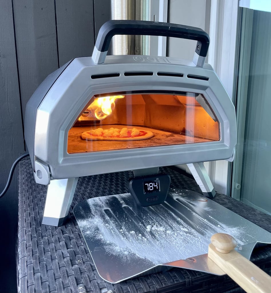 Ooni Koda 12 Gas Pizza Oven ($399)
The Ooni Koda 12 Gas Pizza Oven is perfect for creating delicious stone-baked pizzas wherever (and whenever) dad wants. This portable gas pizza oven is super sleek and can fire up in 15 minutes and cook 13-inch pizzas. It's also great for roasting veggies and cooking meats. Grilling season, here we come! Read our in-depth review of the Ooni Pizza Oven.
Editor Quote: One of our editors says that this pizza oven "is a total crowd pleaser and party must have. If you have to feed a bunch of people, you can serve several pizzas swiftly. I also appreciate how easy the design is to use — you don't need to be some chef extraordinaire to make spectacular pizzas. That being said, my chef boyfriend with ridiculously high standards is equally impressed with the results as my father who barely knows how to boil water. It's truly a product designed for anyone." — Macy Cate Williams, former shopping director