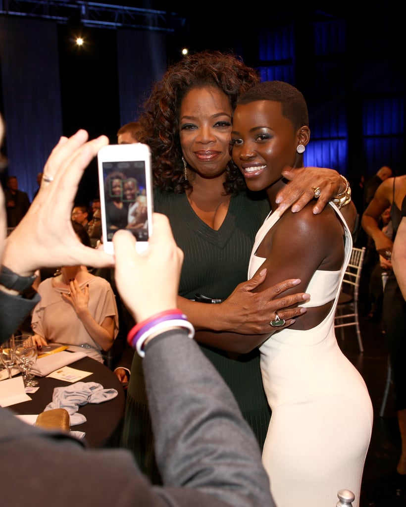 Lupita Nyong'o and Oprah posed for a photo.