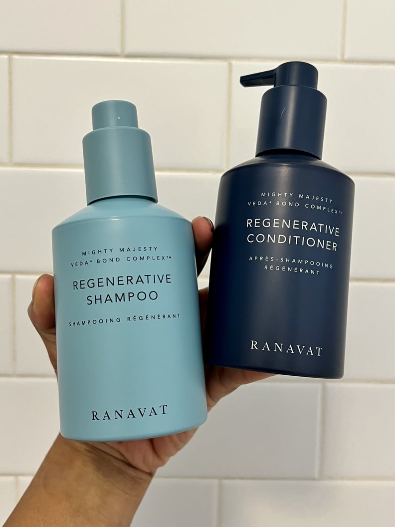 Person holding the Ranavat Regenerative Veda⁴ Bond Complex Shampoo and Conditioner.