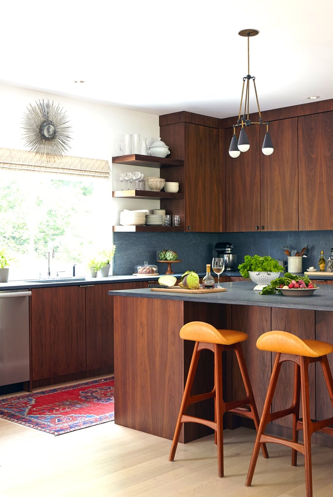 The kitchen is equally stylish with honed slate that extends from the counters to the walls as a backsplash. It's midcentury with a contemporary twist.
Check out the full house tour — including an unbelievable game room — on Domaine!