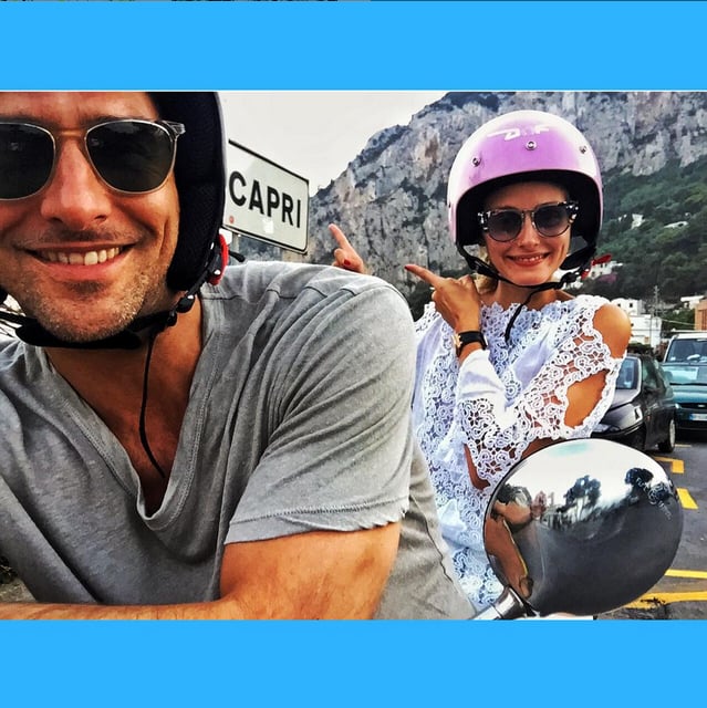 Olivia chose a lacy cold-shoulder tunic for an outing on a Vespa. She accessorized with embellished statement sunglasses and, of course, a fashionable pink helmet.