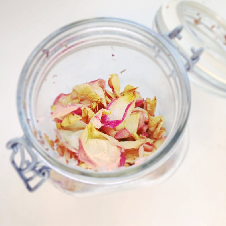 Using dry rose petals to make rose potpourri which is great for home scent.  Mason jar filled with dry rose petals and puds with meditating Buddha Stock  Photo - Alamy