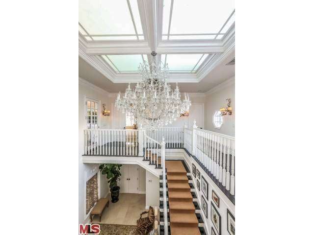 A massive crystal chandelier lights the way to the private family quarters upstairs.
