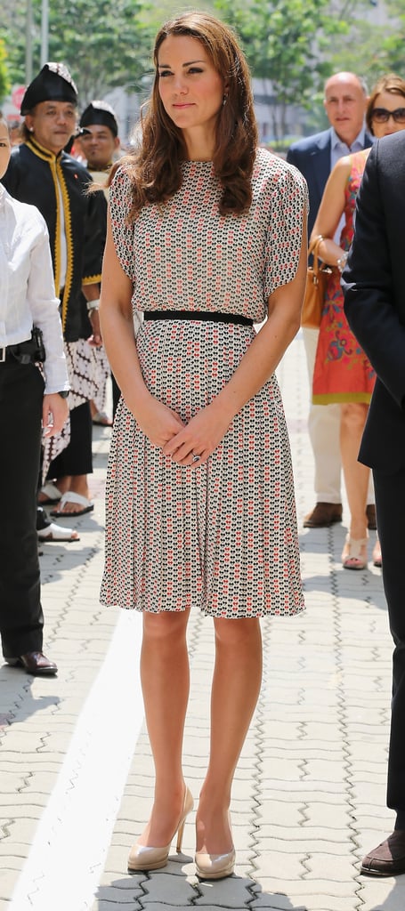 The Duchess Teamed A Blouse With Pleated Knee Length Skirt And