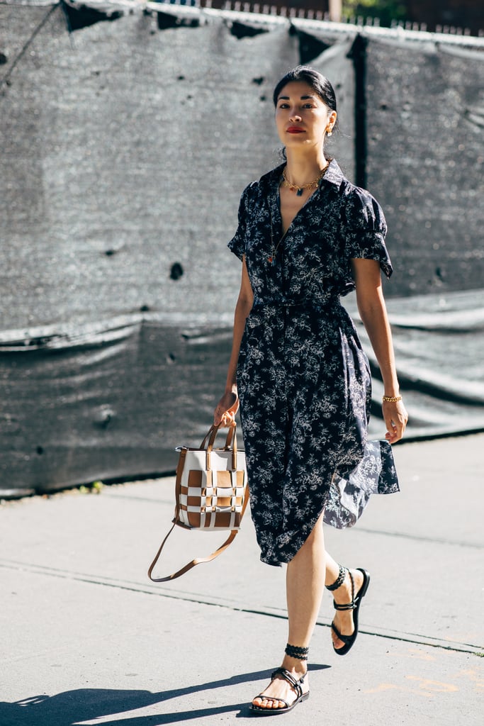 A bohemian dress with a mini tote bag, layered necklaces, and gladiator sandals is easy as pie.