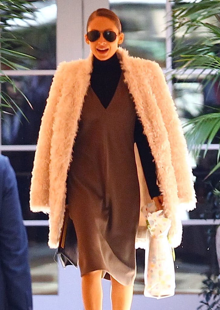 Nicole donned a large coat.