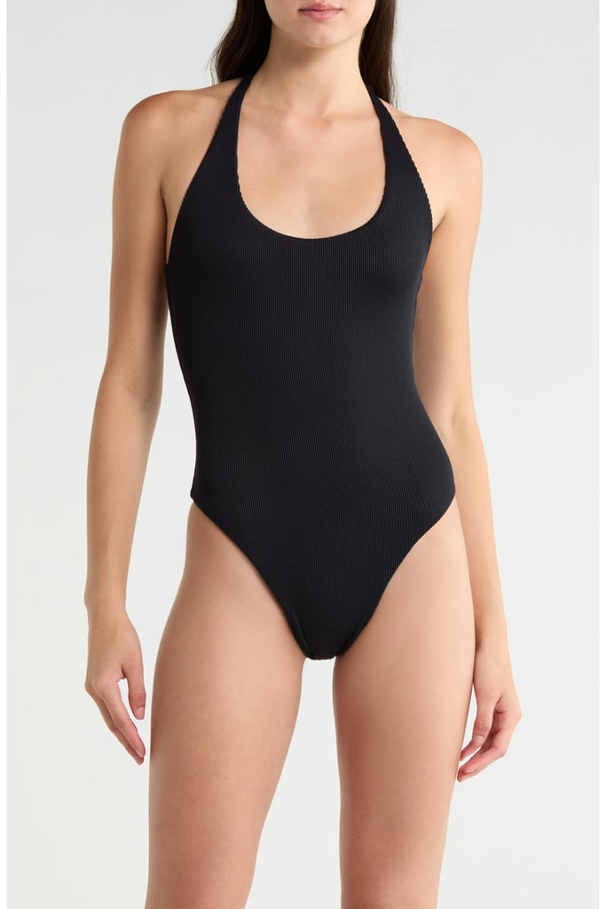 Kulani Kinis Scoop Neck Halter Cheeky One-Piece Swimsuit ($98)
Halter tops, dresses, and swimsuits are everywhere for summer 2026. This chic black one-piece is the perfect way to join in on the trend. Bonus points for the adjustable tie top so you can find the ideal fit each time.
