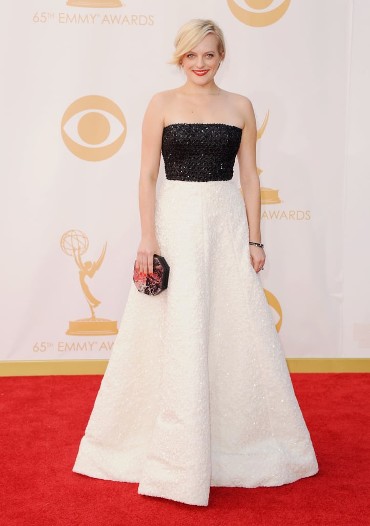 She wore an Andrew Gn dress, Casadei shoes, Neil Lane jewels, and a Rauwolf clutch to the 2013 Emmys.