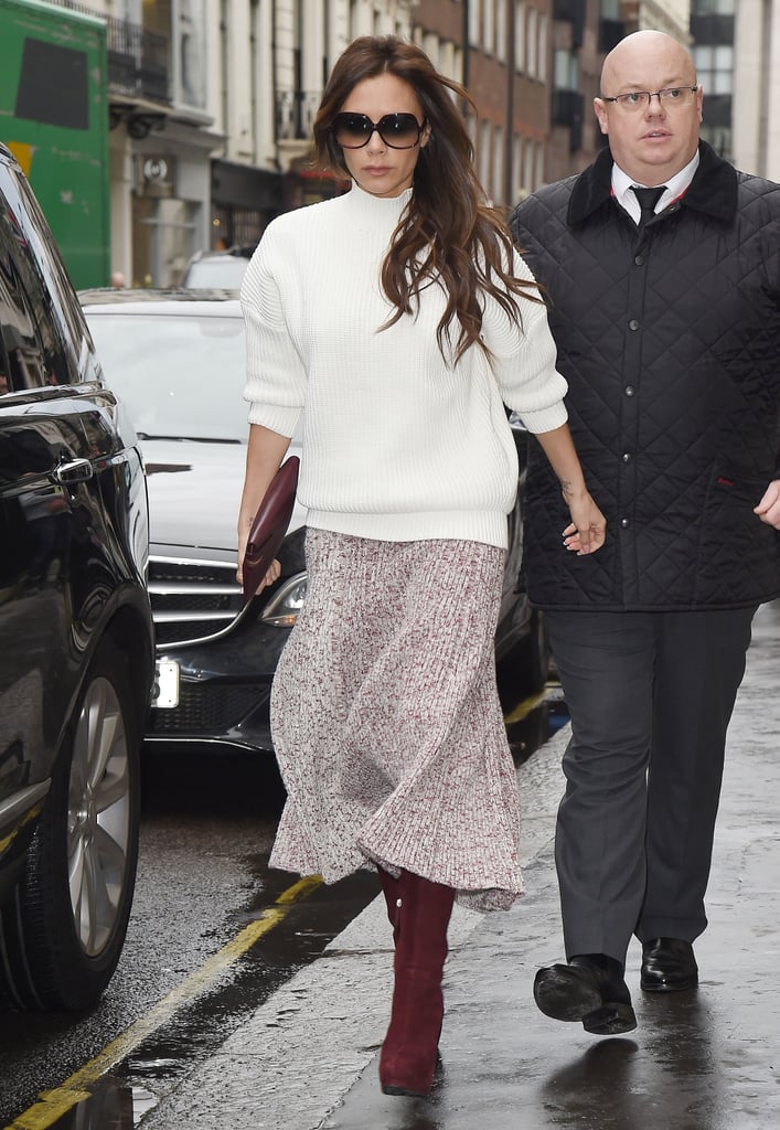 Victoria Beckham stayed dry in London on Friday.