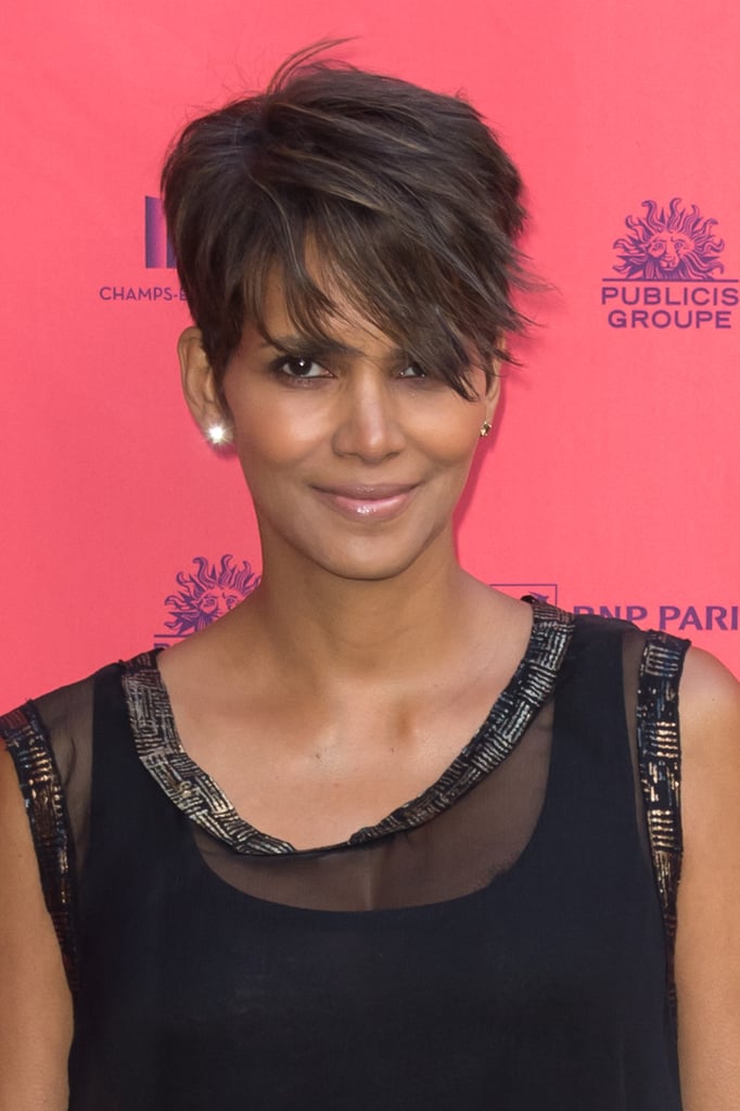 To give her iconic haircut dimension, Halle Berry weaves a hint of honey blond throughout her walnut-toned strands.