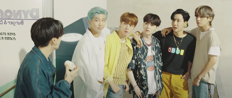 Here's Jungkook wearing a relaxed denim jacket by Louis Vuitton while, BRB, Admiring the Amazing Outfits in BTS's Dynamite Music Video For Hours  on End