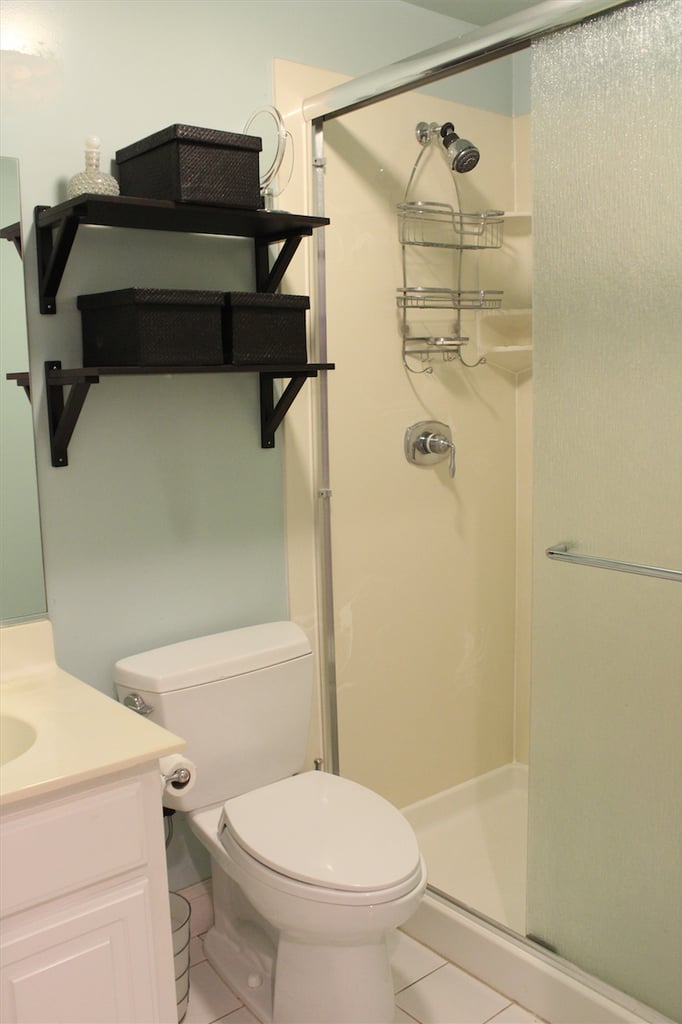 Our Shower Featured A Textured Sliding Glass Door And A Cream