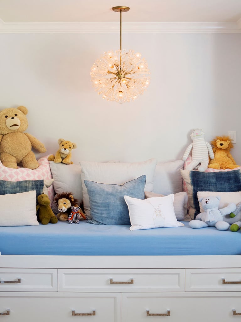 The nursery features streamlined furniture pieces, baby animal photographs by Sharon Montrose, and a showstopping Emil Stejnar Sputnik chandelier. Molly collaborated with Layla Grayce co-owner Tiffany Harris to create the welcoming space.