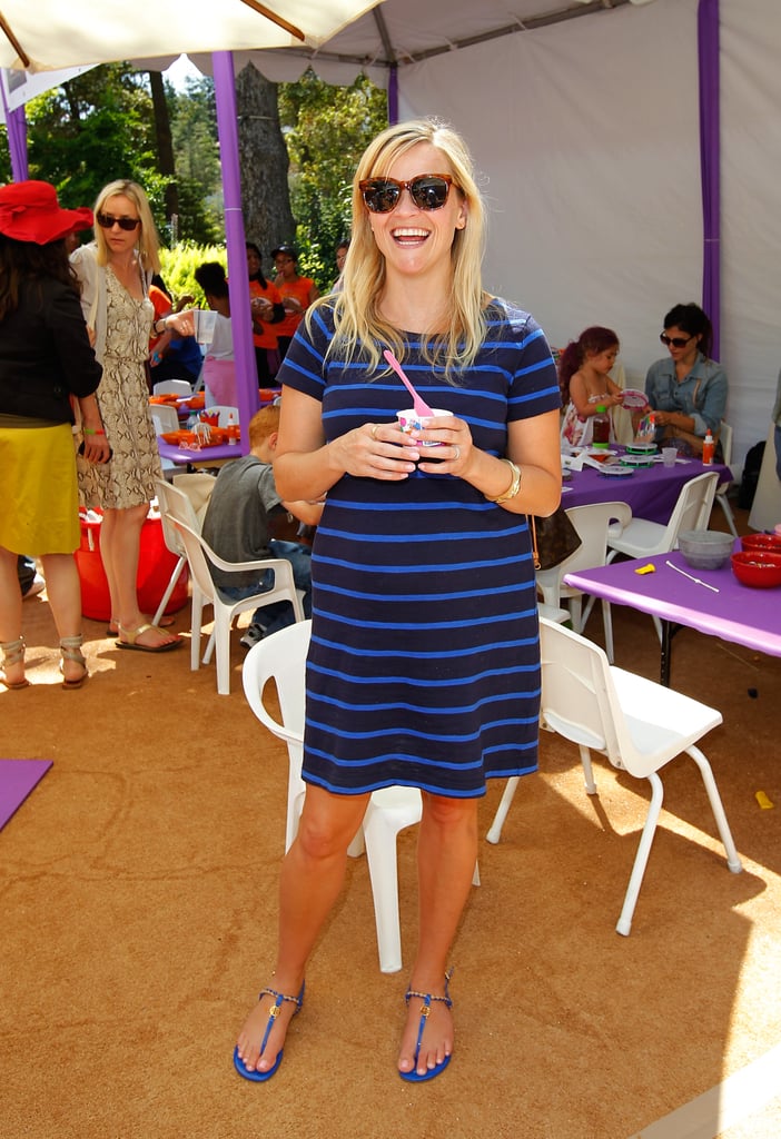 Donning a striped Gap shift and cobalt Tory Burch sandals, Reese proved she's not all about labels with her Summer look.