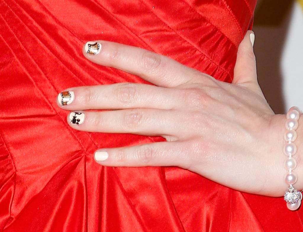 Zooey embraced the film theme at the 2013 Golden Globes with a movie reel manicure designed by none other than Tom Bachik.