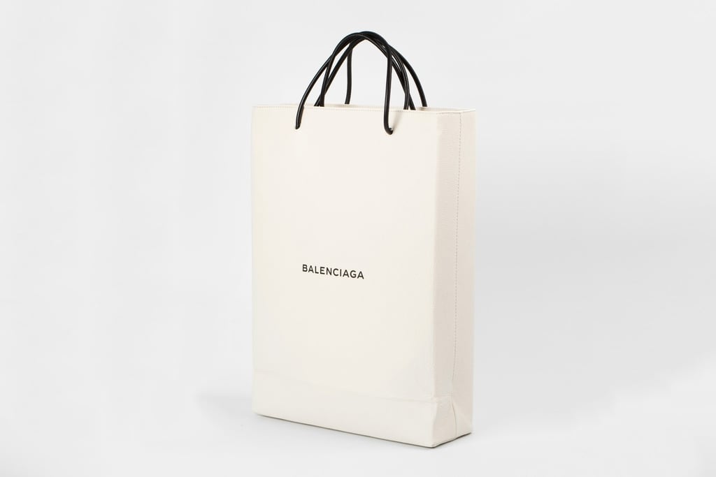 You know those shopping bags you casually toss out (or hoard) after a mall run? Well, Balenciaga is selling one for $1,100. The leather shopping bag is part of the brand's "Colette Takeover" and visually, the tote looks stunning. It has a structured shape, is made from 100 percent calfskin with black Nappa leather handles (PETA beware), and the logo across the front adds a nice little touch. But then reality hits you. The designer piece is basically a replica of the free shopping bags you get — and most people don't truly care about those!
This outrageous accessory comes on the heels of another bag mania where designer Demna Gvasalia created this blue IKEA look-a-like tote. (FYI: It was selling for $2,145.) Though this new leather shopping bag doesn't hit the $2,000 mark, it still nonetheless makes you say, "WTF." The coveted new item is currently sold out, but for those who are obsessed, you can get on the waitlist. Good luck.

    Related:

            
            
                                    
                            

            Warning: Balenciaga&apos;s New Couture Gowns Are Heavy Duty