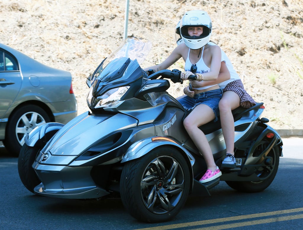 Miley Cyrus and a friend rode around Beverly Hills on a three-wheeler on Monday.