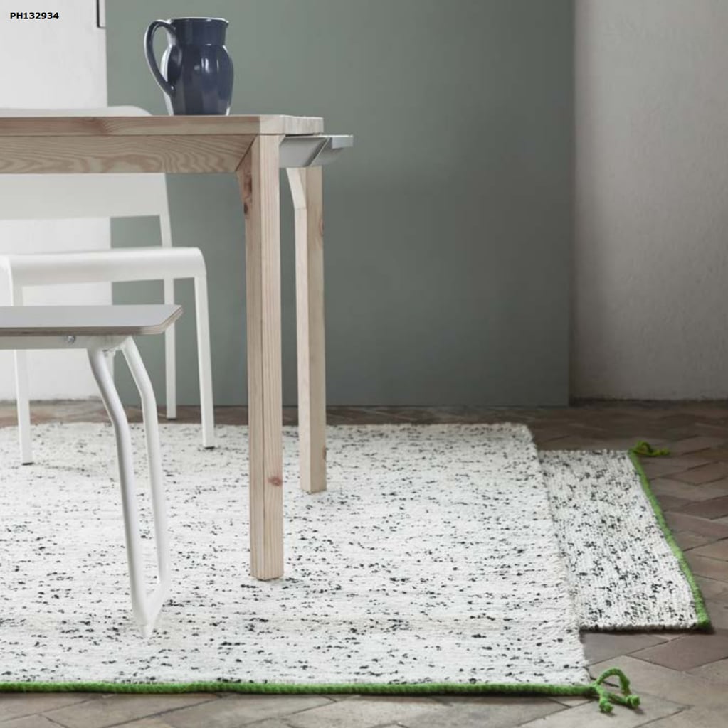 We love how this larger area rug (60) uses white jute and black wool