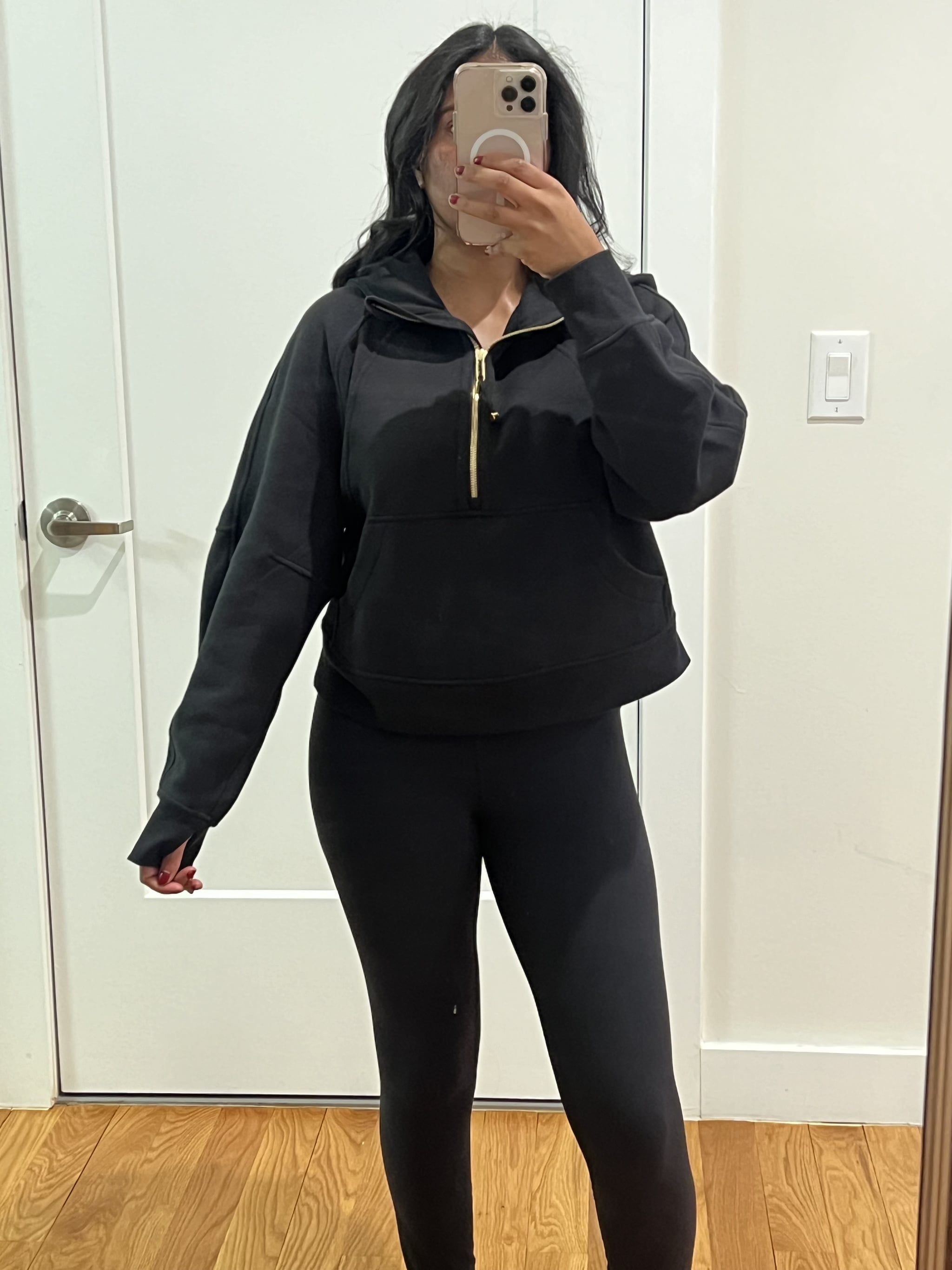 Woman wearing the Lululemon Scuba Oversized Half-Zip Hoodie.