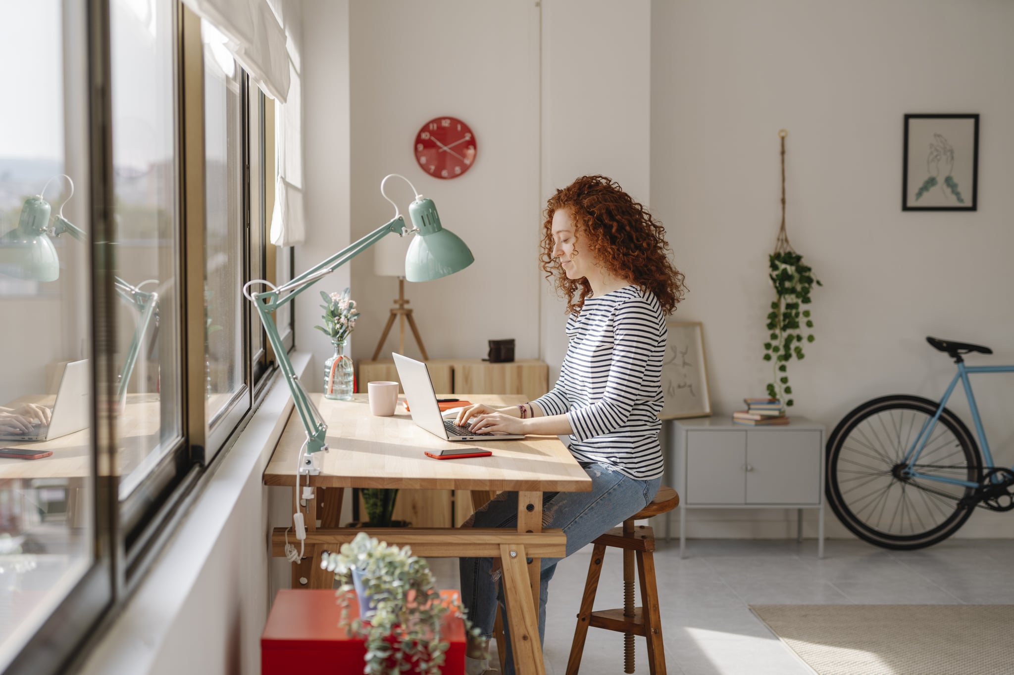 person working at a computer symbolic of Capricorn personality traits