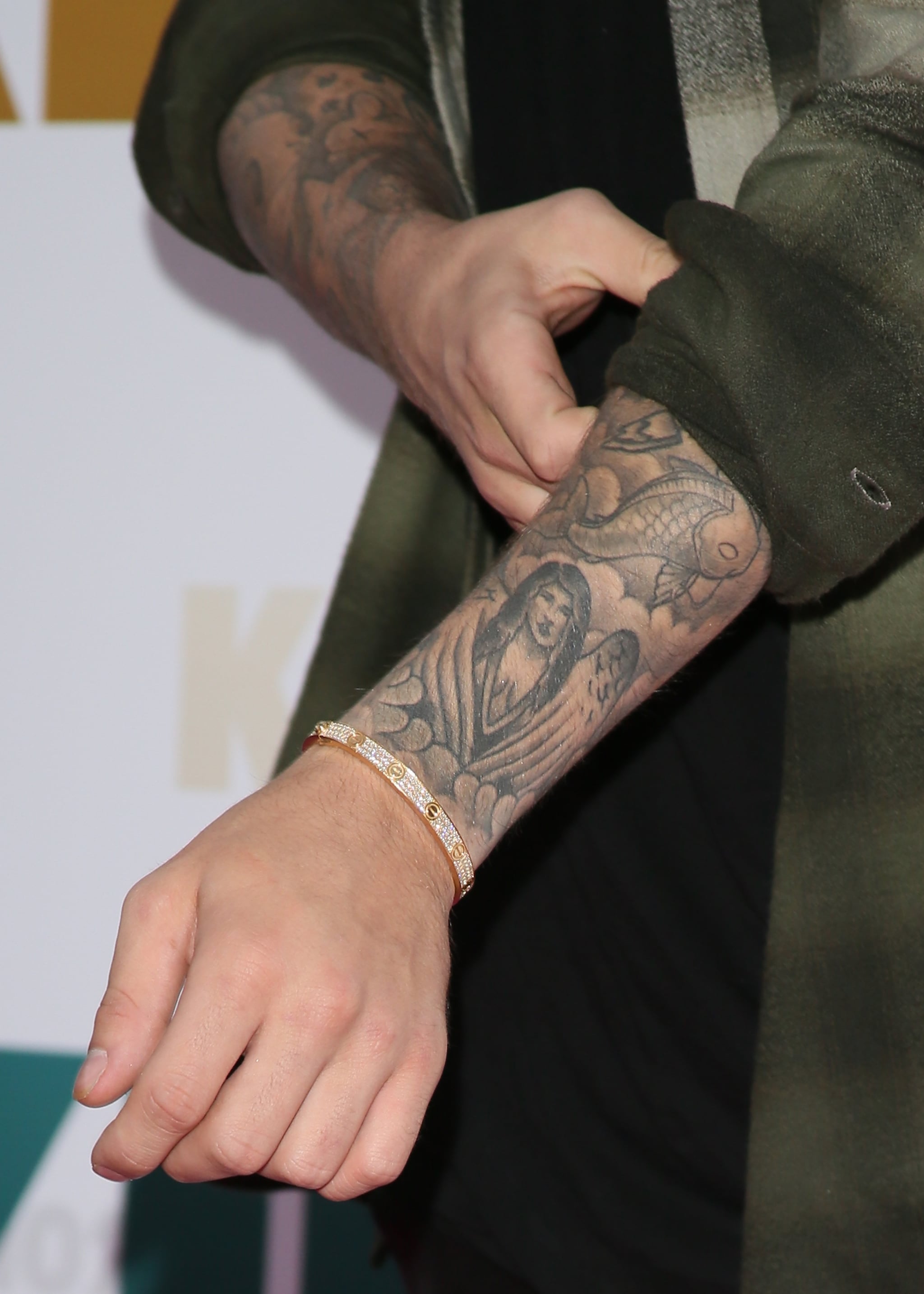 Justin Biebers Tattoos A Selena Gomez lookalike a Crown Jesus Ink  and More