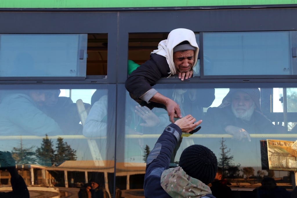 Syrians evacuated from Aleppo arrive to the military-controlled region called Khan al-Aassal on Dec. 15.