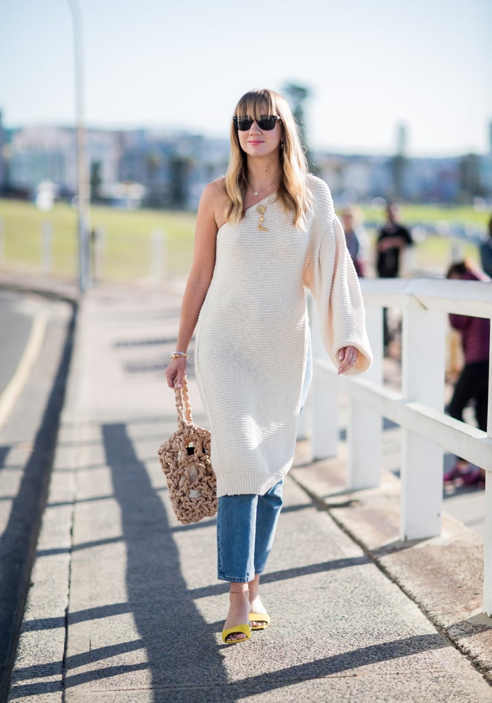 Embrace the layers by wearing a pair under a one-shouldered, knee-length jumper dress.