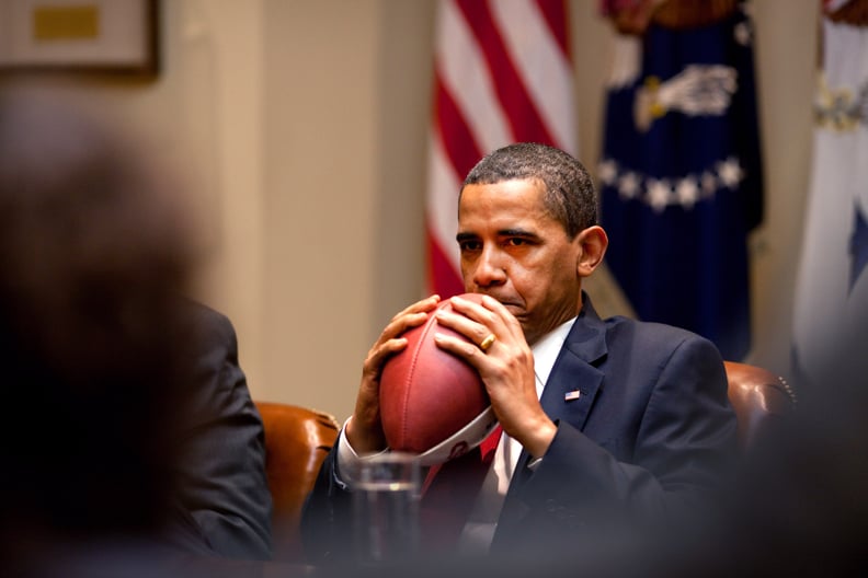 Clutching a football in 2009.