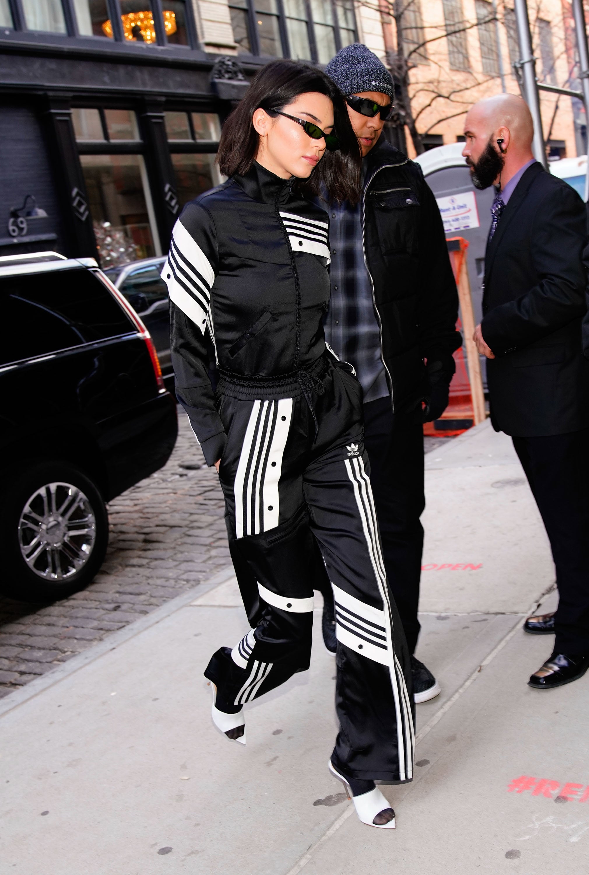 Kendall Jenner Works Out in Cutoff Catsuit & Affordable Adidas Slides –  Footwear News