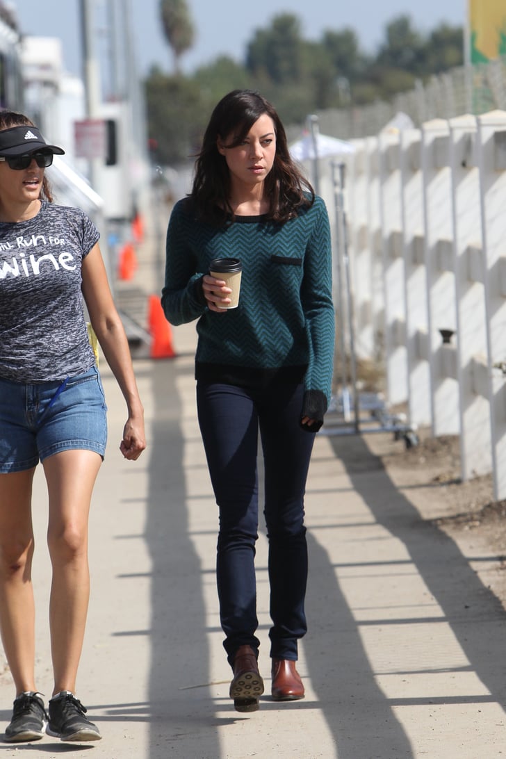 Aubrey Plaza grabs a cup of coffee on the set. | Parks and Recreation