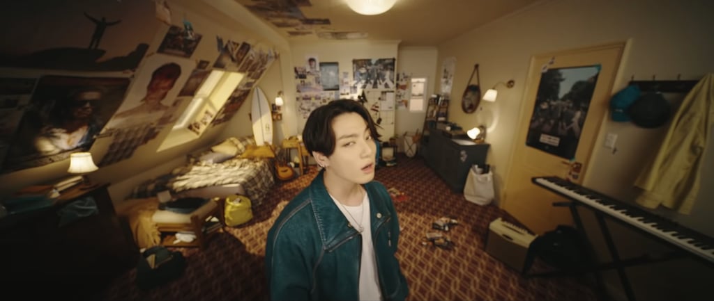 Here's Jungkook wearing a relaxed denim jacket by Louis Vuitton while hanging in his room.
