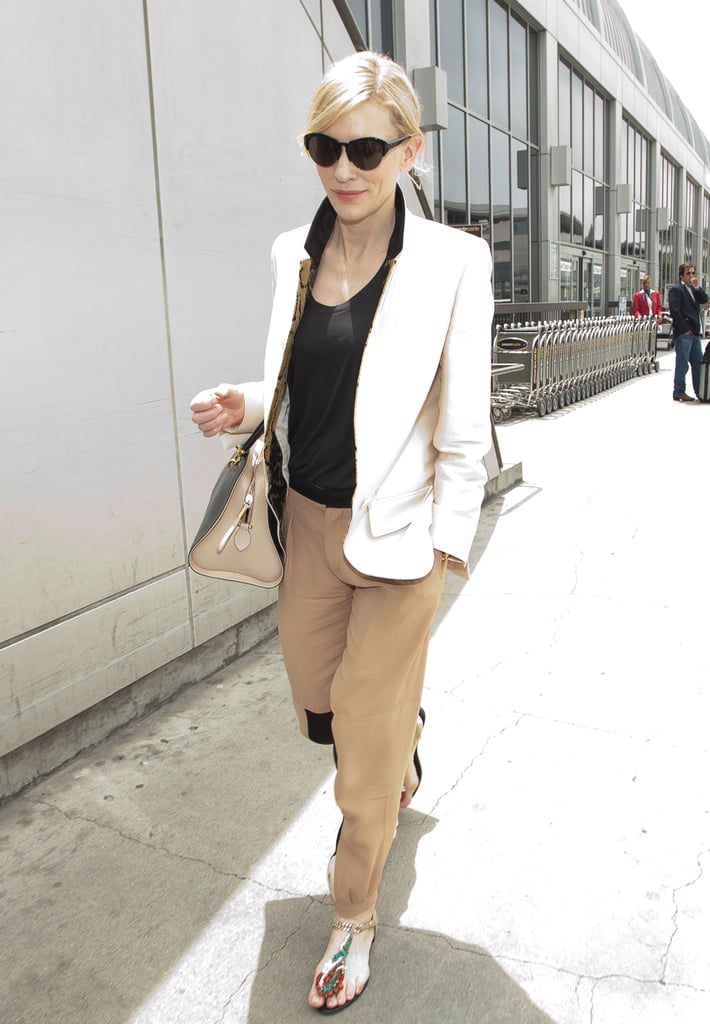 Cate Blanchett arrived at LAX in a chic pairing: a white blazer, tan Chloé trousers, and beaded Roger Vivier sandals.