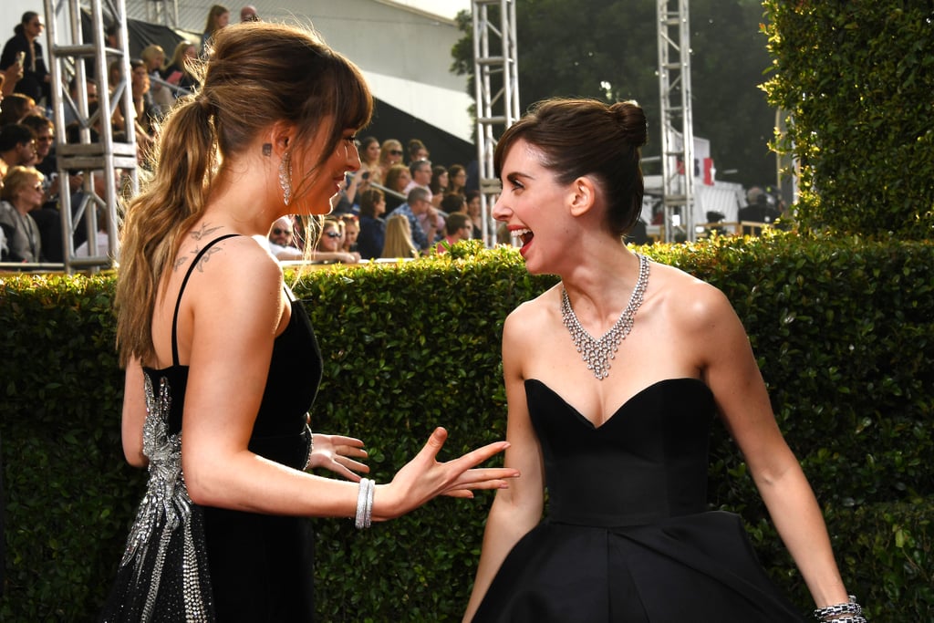 Pictured: Dakota Johnson and Alison Brie