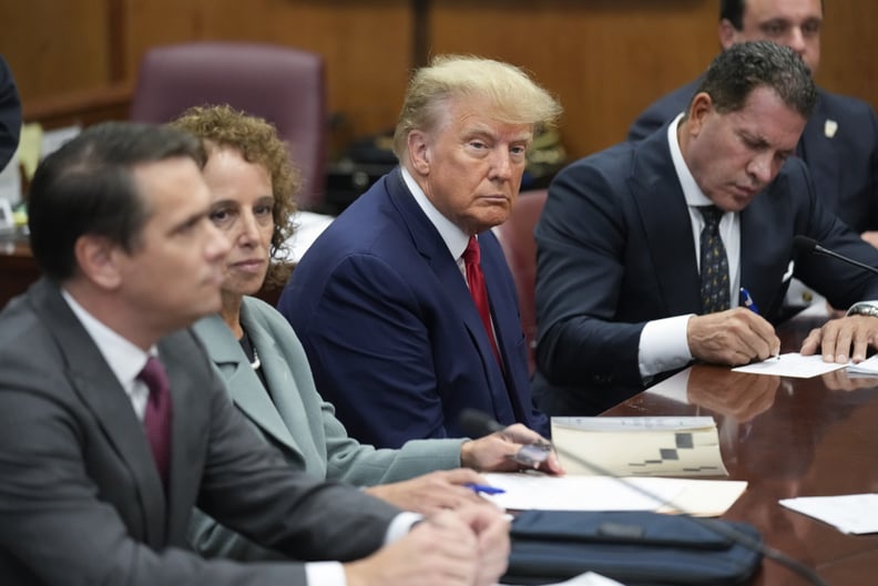 NEW YORK, NEW YORK - APRIL 04: Former U.S. President Donald Trump sits at the defense table with his defense team in a Manhattan court during his arraignment on April 4, 2023, in New York City. Trump was arraigned during his first court appearance today f