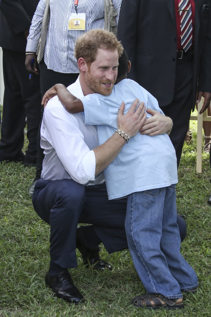 Harry hugged a child at a Charities Showcase event in Antigua in 2016.