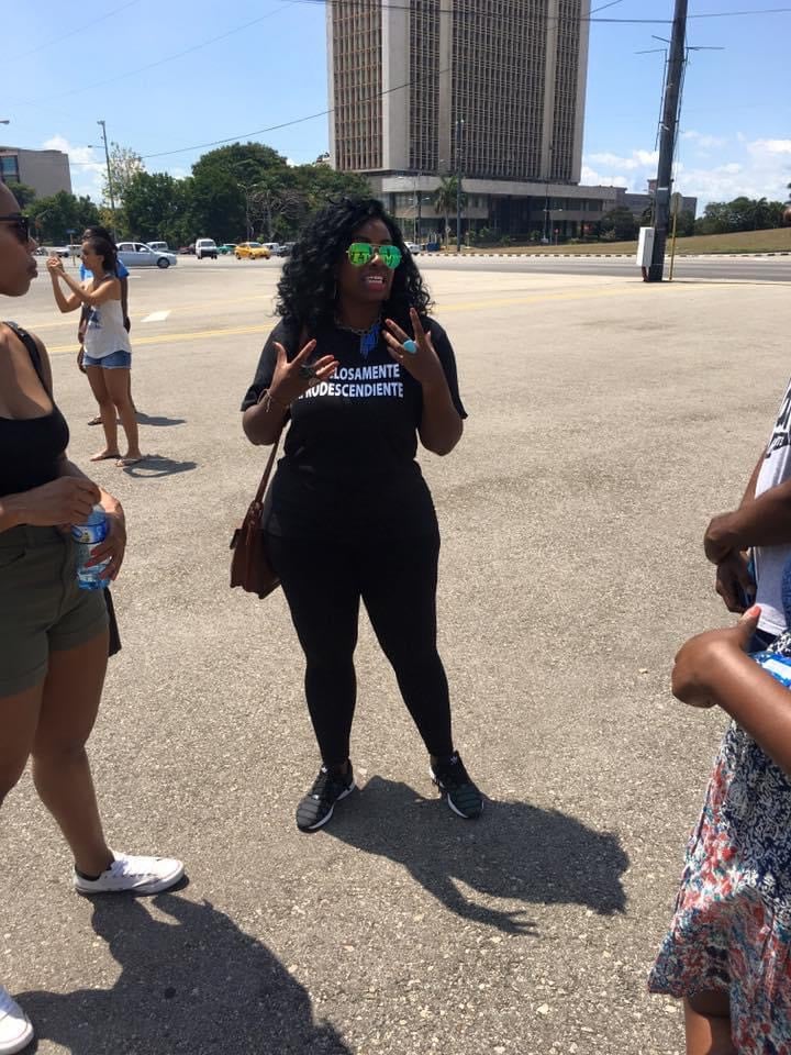 A woman leads a group on a trip.