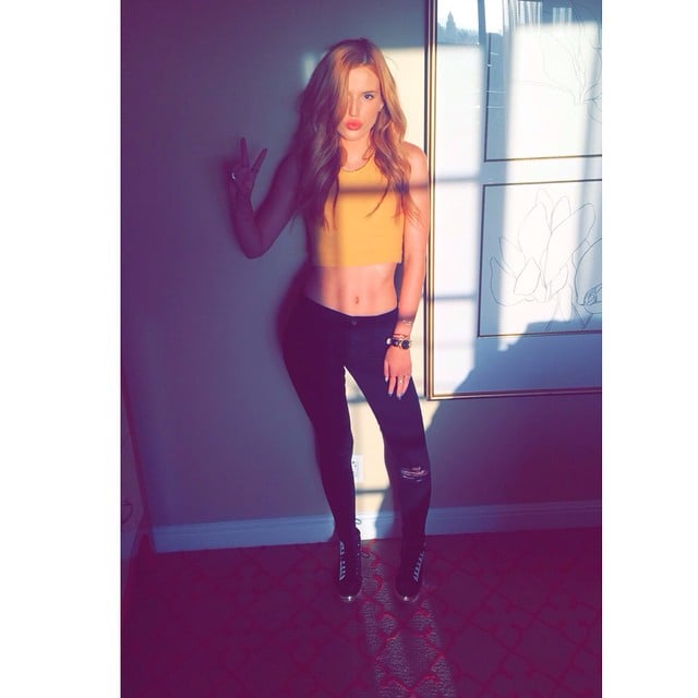 Bella Thorne revealed toned abs and a peace sign in this sunlit shot. 
Source: Instagram user bellathorne