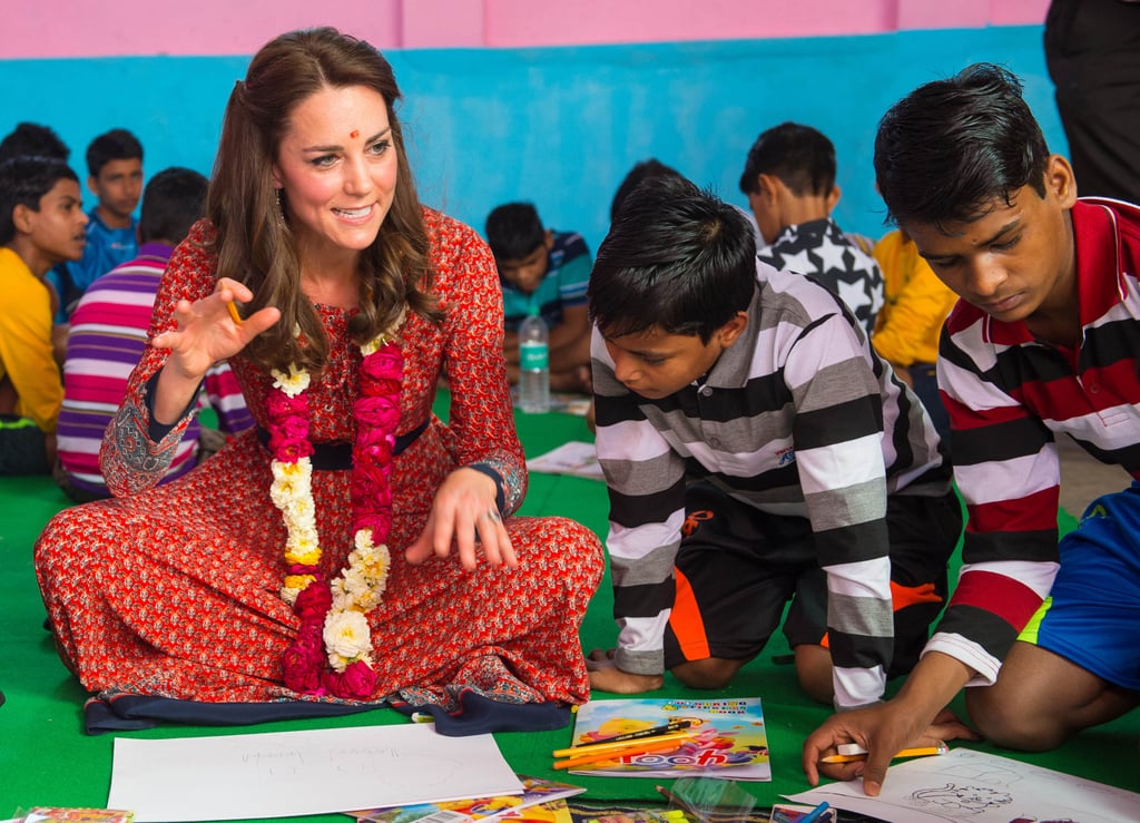 Kate got down on the children's level — literally — when she participated in an arts and crafts class in New Delhi, India in April 2016.