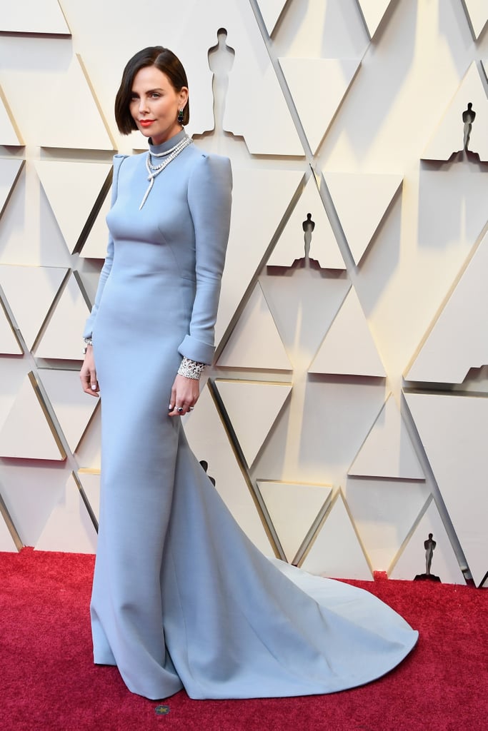 Wearing a Dior Haute Couture gown that had a back cutout that dipped real low. She accessorized with a Bulgari jewels and Jimmy Choo sandals.