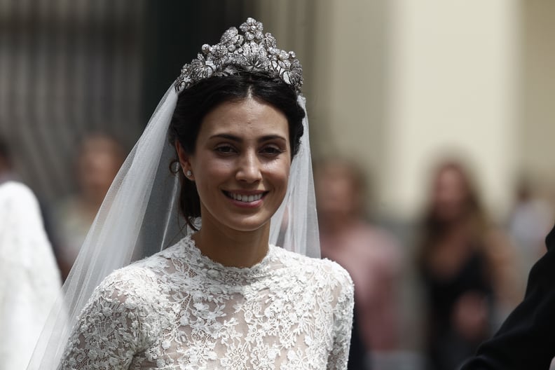 Her High-Neck Gown Featured Intricate Lace Details