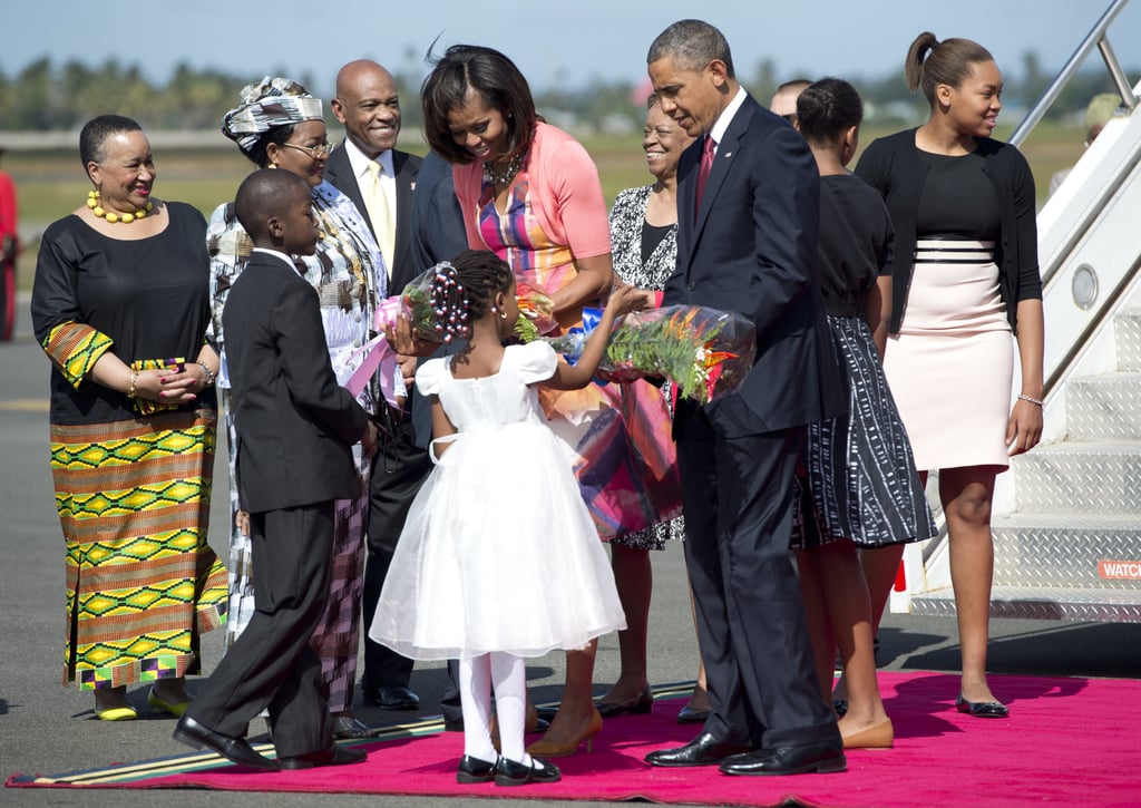 Children greeted President Obama and First Lady Michelle with flowers when they arrived in Dar Es Salaam, Tanzania, in July 2013.