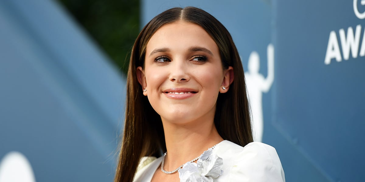 millie bobby brown blue sparkly dress Millie Bobby Brown Wears Liquid Silver Gown at the Brit Awards 2025